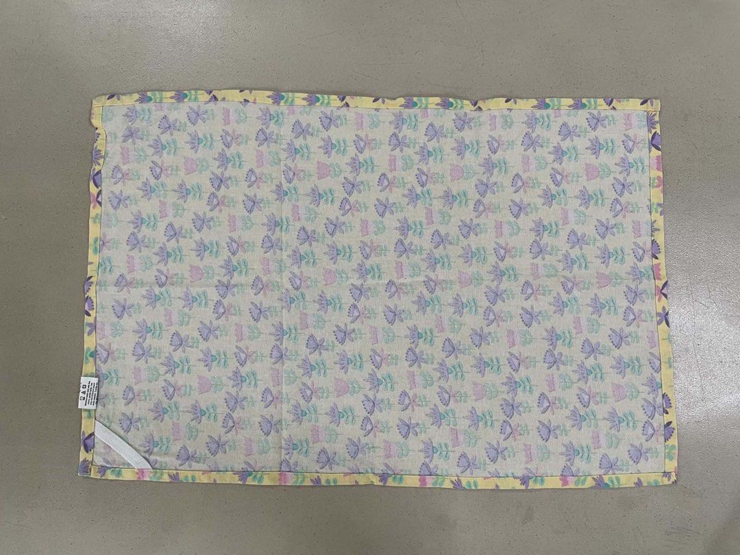 Yellow Floral Fabric Doily (Category: Table Linen & Textiles) located in Quezon City. Submitted by meggoquingco (Listing ID 1462329380, Image 3). Description: - Cute yellow base with repeating purple, pink, and blue floral and leaf pattern - Adds a pop of color to your table setting - Approximate measurements: 16 inches x 24 inches - Ideal for everyday use or special occasions.