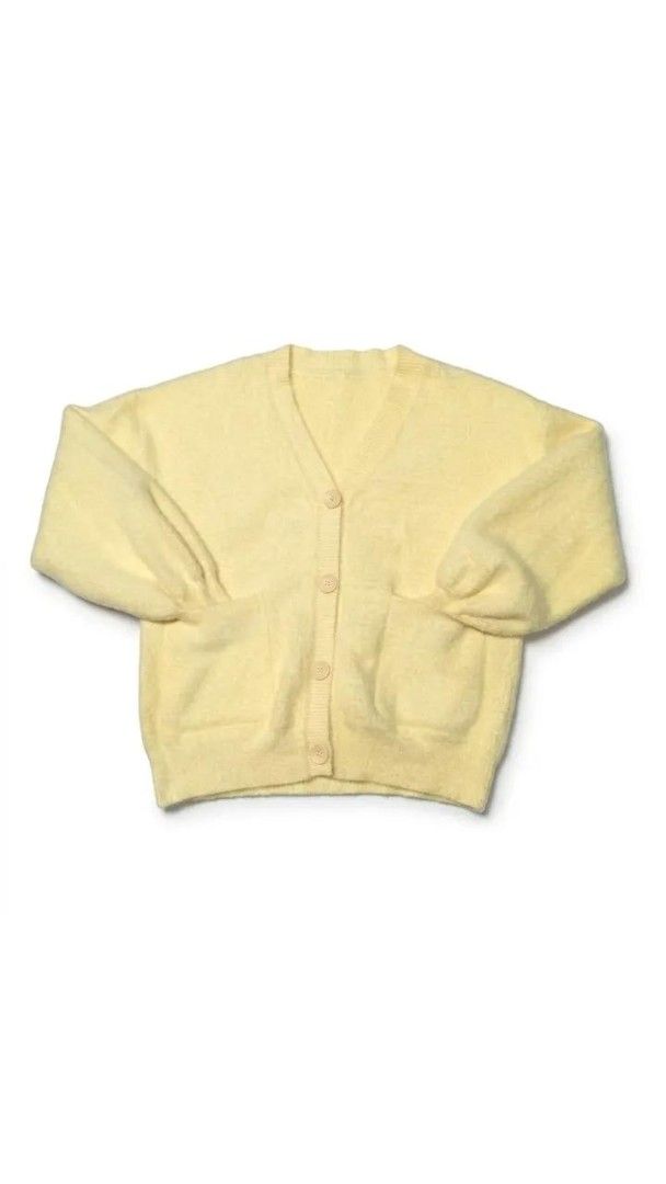 Yellow Fuzzy Button-Up Cardigan with Pockets (Category: Coats, Jackets and Outerwear) located in Manila. Submitted by silentstone.4b0628 (Listing ID 1462394938, Image 1). Description: - Adorable yellow fuzzy cardigan - Functional buttons down the front - Two convenient pockets - Stylish puffy sleeves - Incredibly soft and cozy material - Ideal for layering - Perfect for a casual, comfortable look.