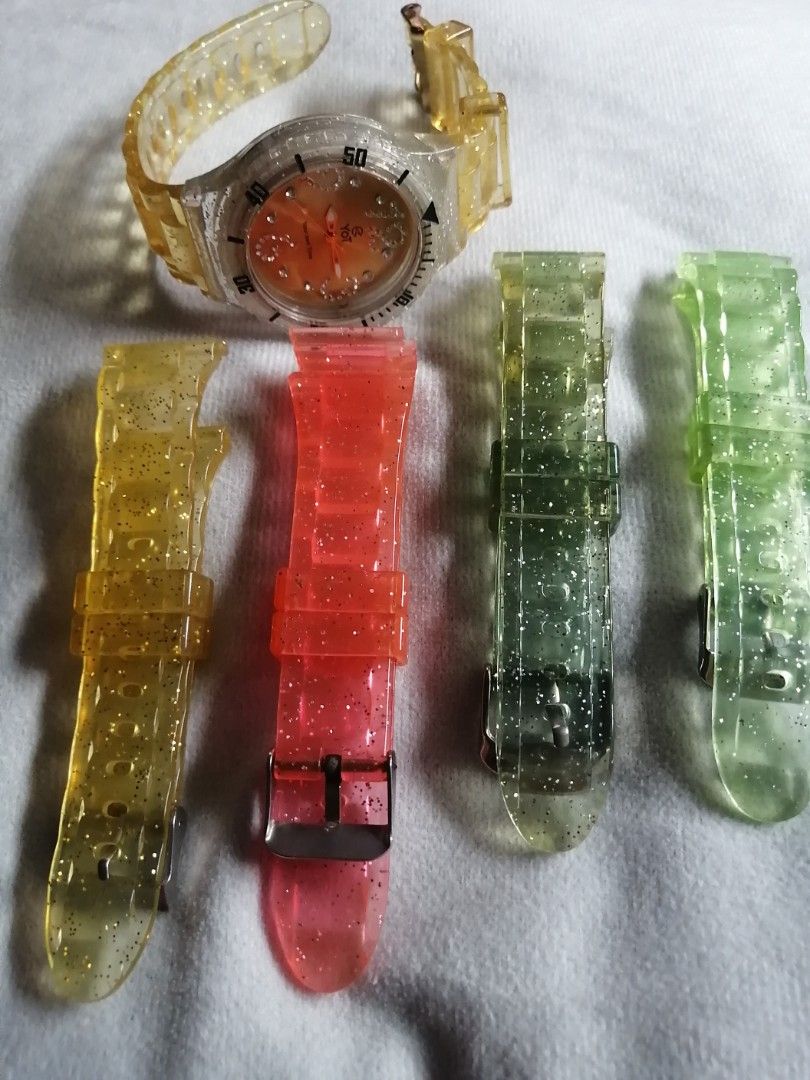 YOT Watch with Interchangeable Bezel and Straps (Category: Women's Watches) located in Quezon City. Submitted by globaltravelboutique (Listing ID 1462310285, Image 3). Description: - YOT watch with a gold dial - Includes multiple colorful bezels for easy outfit matching - Clear watch band and bezel with glitter accents - Water resistant up to 10 ATM - Perfect for creating a personalized style.
