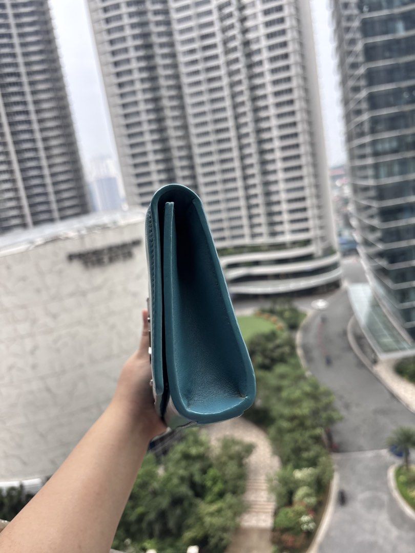 YSL Turquoise Blue Clutch (Category: Luxury Bags & Wallets) located in Paranaque City. Submitted by jujudeclutterss (Listing ID 1462315472, Image 3). Description: YSL Turquoise Clutch Bag Can do meetups in Rockwell Makati.