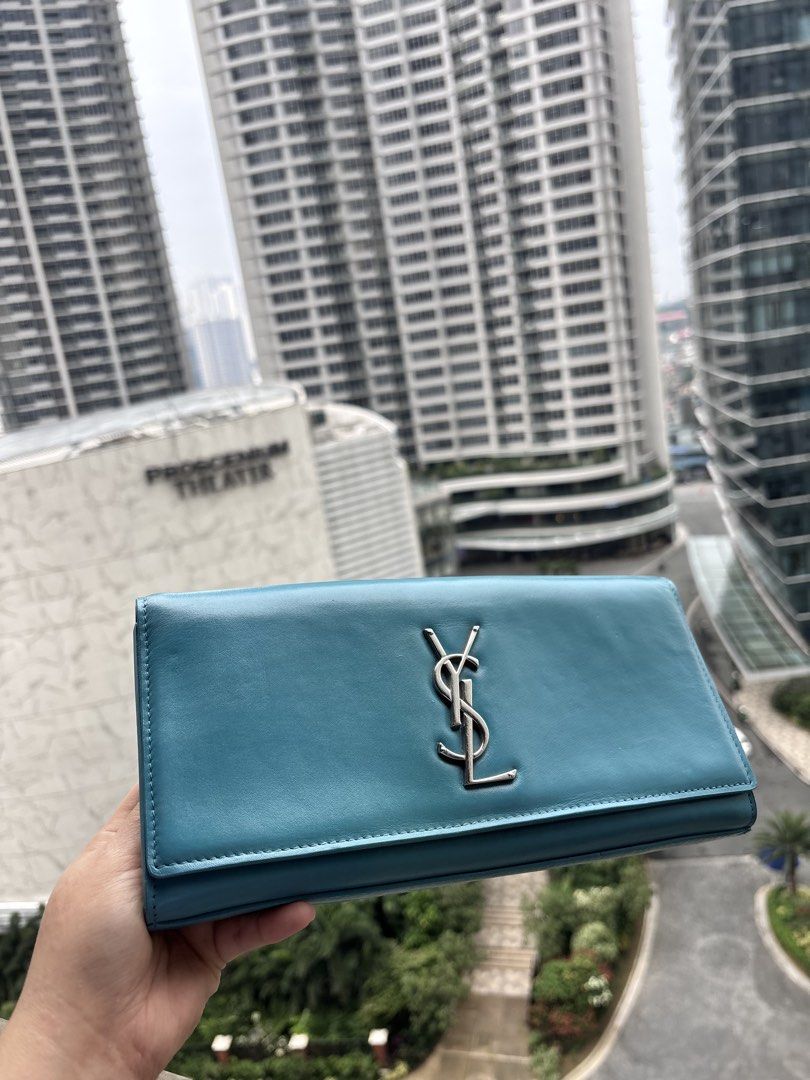 YSL Turquoise Blue Clutch (Category: Luxury Bags & Wallets) located in Paranaque City. Submitted by jujudeclutterss (Listing ID 1462315472, Image 2). Description: YSL Turquoise Clutch Bag Can do meetups in Rockwell Makati.