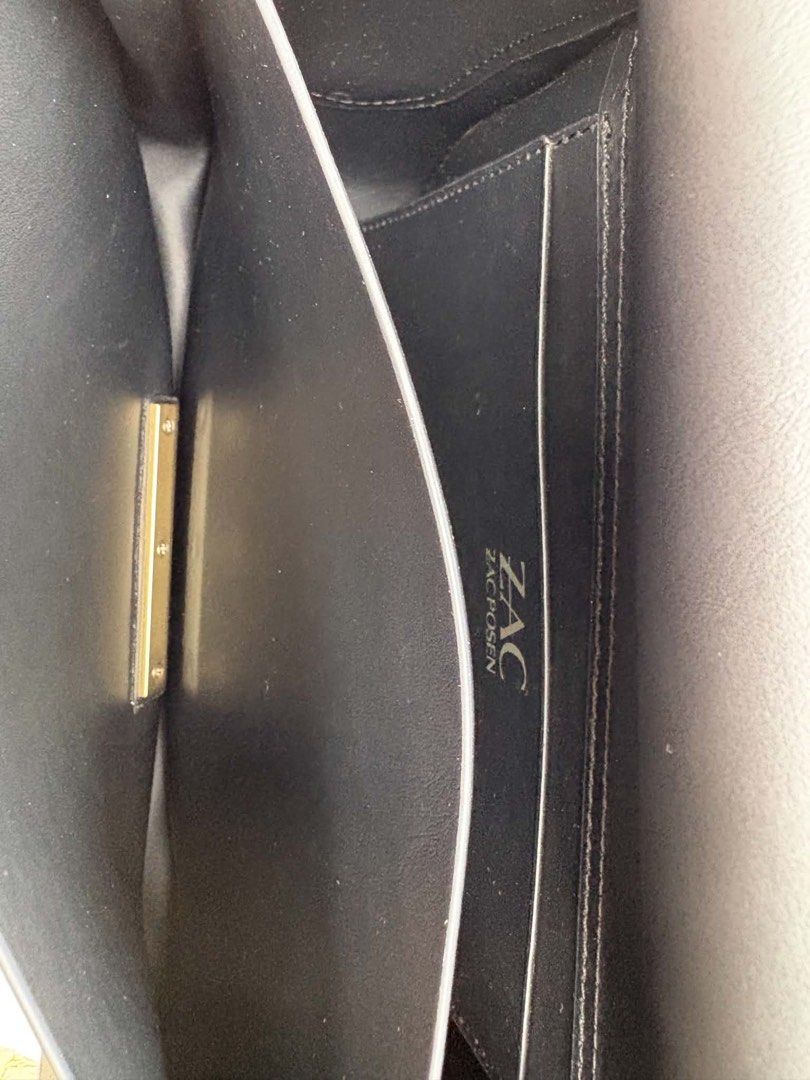 Zac Posen Black Leather Shoulder Bag (Category: Shoulder Bags) located in Quezon City. Submitted by chadbalinjit (Listing ID 1462292919, Image 3). Description: - Authentic Zac Posen shoulder bag - Classic black leather - Secure gold-tone clasp closure - Convenient interior slip pocket - Adjustable shoulder strap for comfort - Versatile for daily wear or special events NOW SELLING FOR 6,000 Bought it for 20k+ from US Rfs: NEED FUNDS LANG PO can do