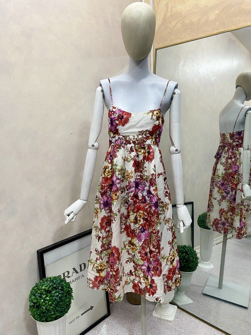 ZARA BASIC Floral Print Midi Dress (Category: Dresses) located in Tanauan. Submitted by oochiecoochie (Listing ID 1462408673, Image 1). Description: White midi dress with a vibrant floral print. Features spaghetti straps and a cinched waist. The fabric is a blend of cotton and silk. Perfect for summer occasions. Made in Morocco. Size S..