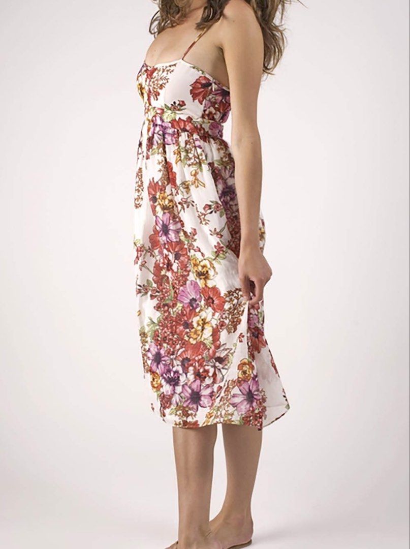 ZARA BASIC Floral Print Midi Dress (Category: Dresses) located in Tanauan. Submitted by oochiecoochie (Listing ID 1462408673, Image 3). Description: White midi dress with a vibrant floral print. Features spaghetti straps and a cinched waist. The fabric is a blend of cotton and silk. Perfect for summer occasions. Made in Morocco. Size S..