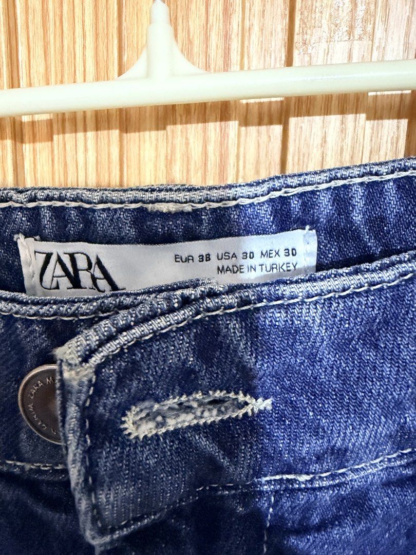 ZARA Blue Denim Jeans (Category: Jeans) located in Makati City. Submitted by ziagabrielle (Listing ID 1462301333, Image 2). Description: - Brand: ZARA - Color: Blue Denim - Fit: High-waisted, Straight leg with tapered ankle - Size: 30 (EU 38) - Origin: Made in Turkey - Occasion: Casual wear -W31-32.