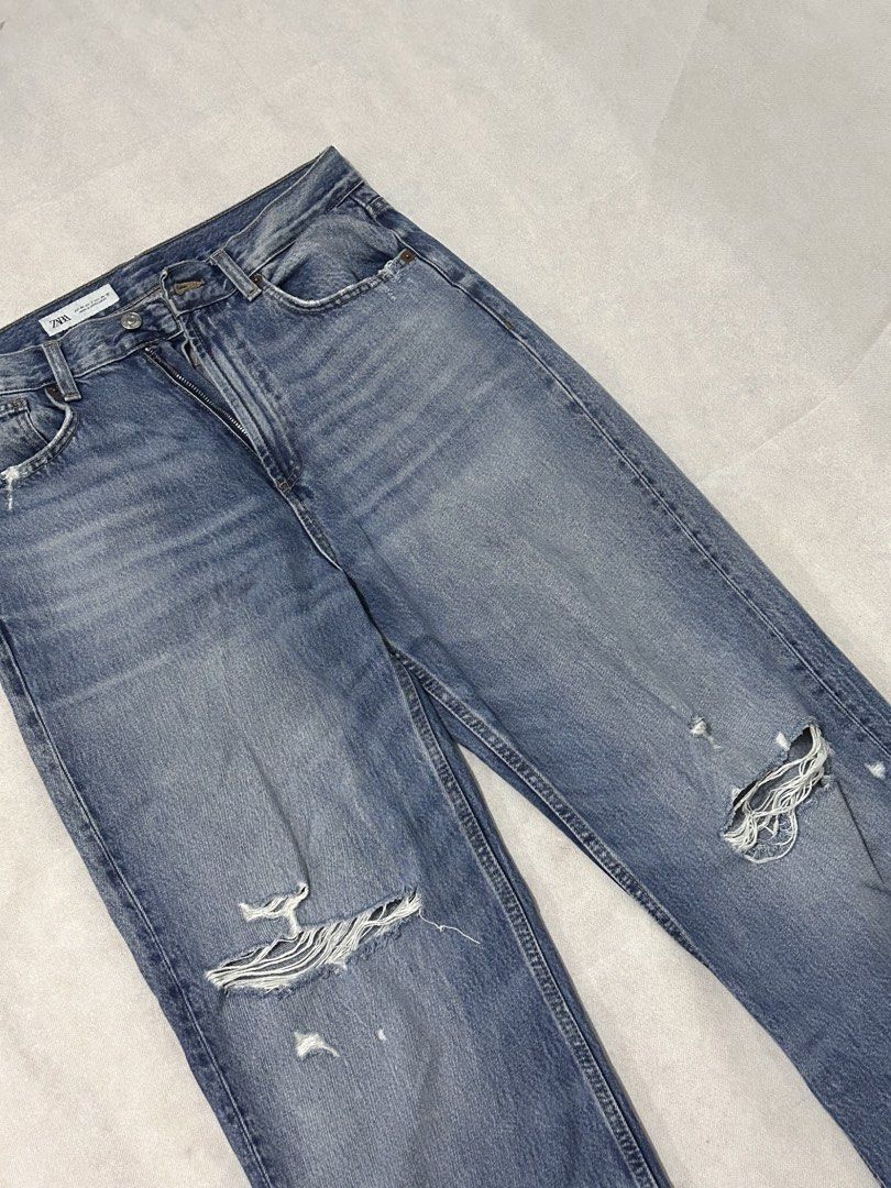 ZARA Blue Distressed Wide Leg Jeans (Category: Jeans) located in Imus. Submitted by donnasaurr19 (Listing ID 1462348886, Image 2). Description: - Brand: ZARA - Style: Wide leg jeans - Fit: High waisted - Details: Distressed knees - Occasion: Casual wear - Styling tip: Pair with crop top or t-shirt - Measurements: W-30 / L42 ☺️.