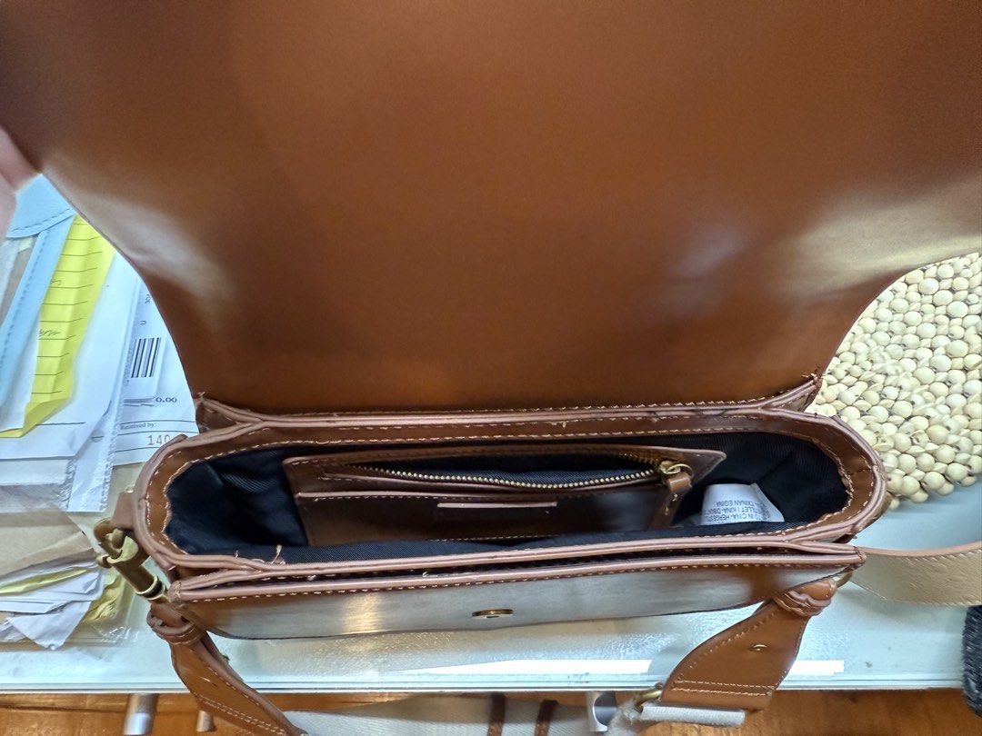 Zara Brown Leather Shoulder Bag with Canvas Strap (Category: Shoulder Bags) located in Pasig City. Submitted by aria.dc.fonacier (Listing ID 1462366652, Image 3). Description: - Brand: Zara - Color: Brown - Material: Leather finish with sturdy canvas strap - Interior: 1 zippered pocket, 1 slip pocket - Hardware: Gold details - Style: Shoulder bag - Ideal for: Everyday use, fits essentials.