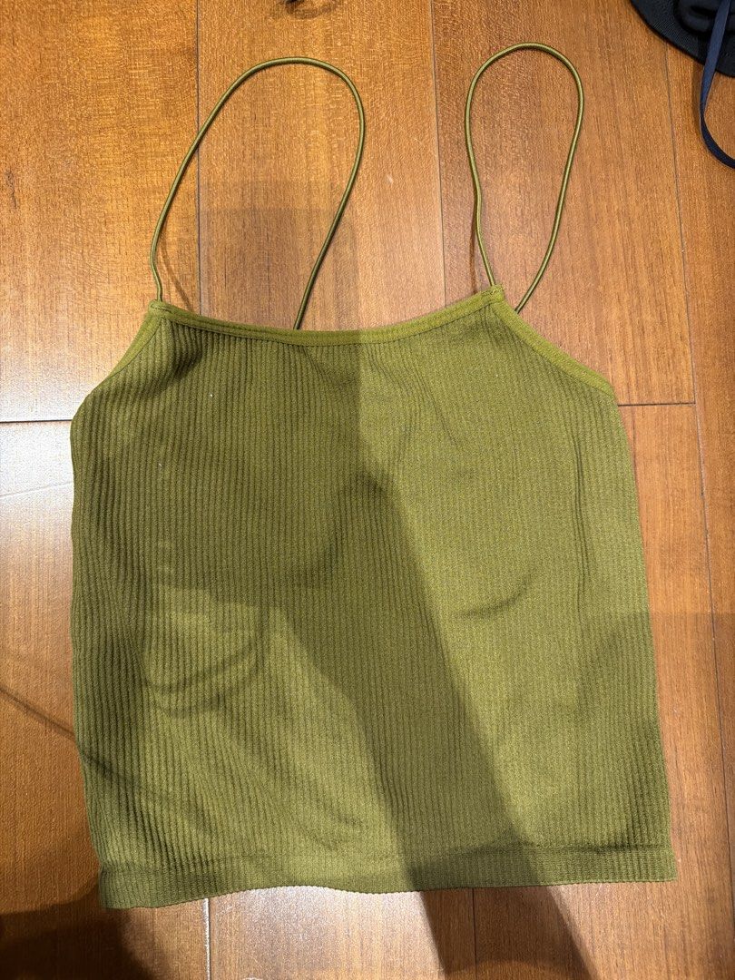 Zara contour collection (Category: Sleeveless) located in Manila. Submitted by megcloset__ (Listing ID 1462371889, Image 1). Description: - Olive green ribbed crop top - Thin spaghetti straps - Stretchy material - Best fits XS/S - Versatile for layering or wearing alone - Easy to style with any outfit.