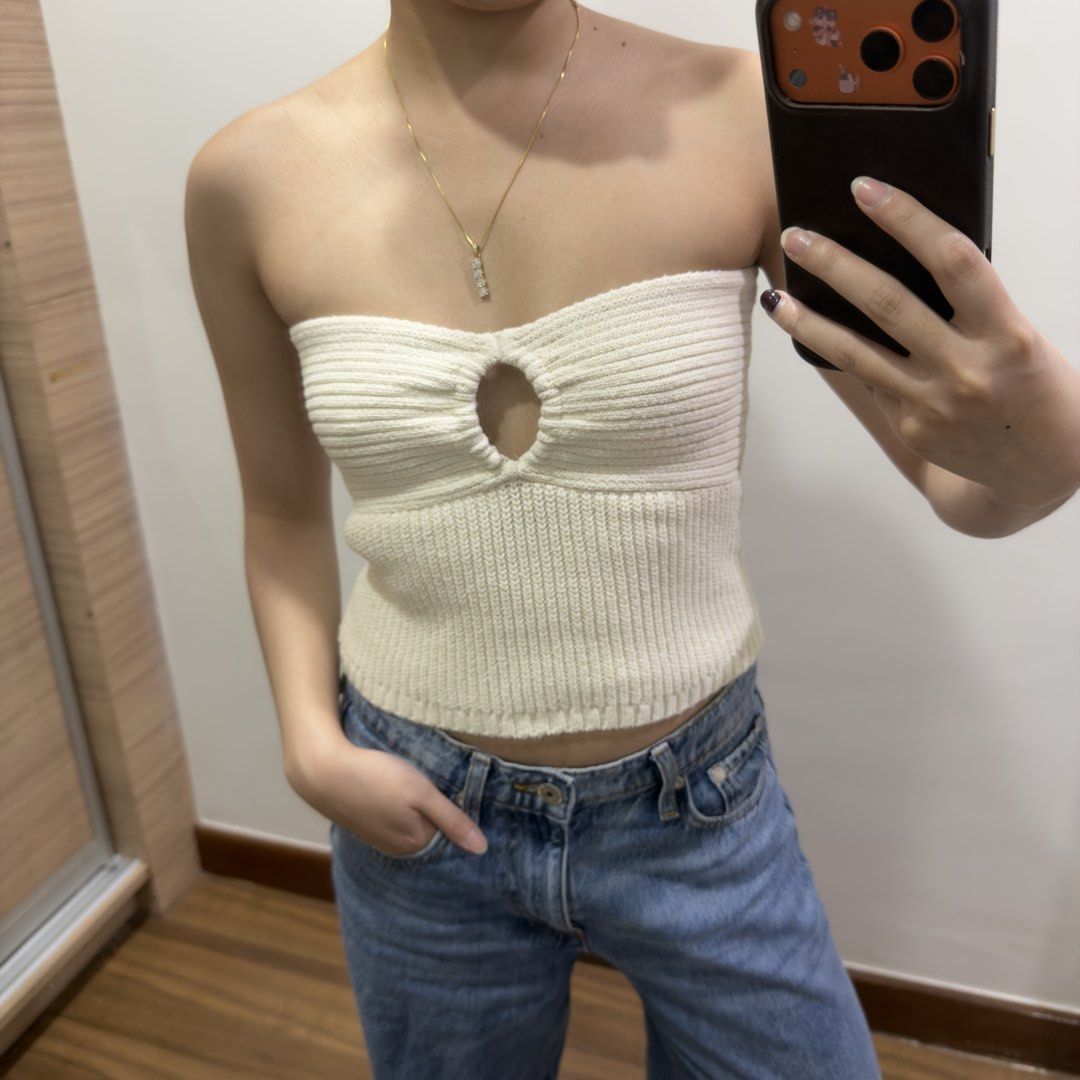 Zara Cream Tube Top (Category: Sleeveless) located in Quezon City. Submitted by miumuse_ (Listing ID 1462300489, Image 3). Description: - Cream ribbed tube top - Features a cute cutout detail at the bust - Stretchy knit material - Versatile: pairs well with high-waisted jeans or skirts - Ideal for casual outings or nights with friends.