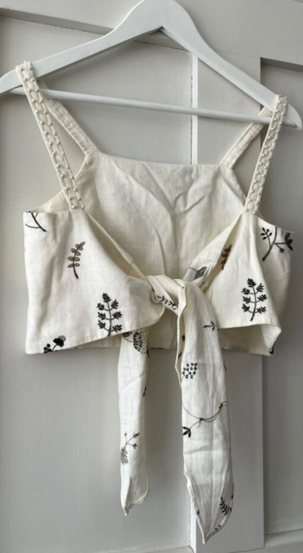 Zara Embroided Linen Top (Category: Others Tops) located in Davao. Submitted by theresetshelf (Listing ID 1462356038, Image 2). Description: 💐off white linen blend 🌷 delicate floral embroidery 🌹beaded strap detail 🌸 tie-back 🌼XS on tag but can be fit to small med..