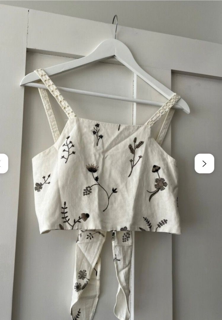 Zara Embroided Linen Top (Category: Others Tops) located in Davao. Submitted by theresetshelf (Listing ID 1462356038, Image 1). Description: 💐off white linen blend 🌷 delicate floral embroidery 🌹beaded strap detail 🌸 tie-back 🌼XS on tag but can be fit to small med..