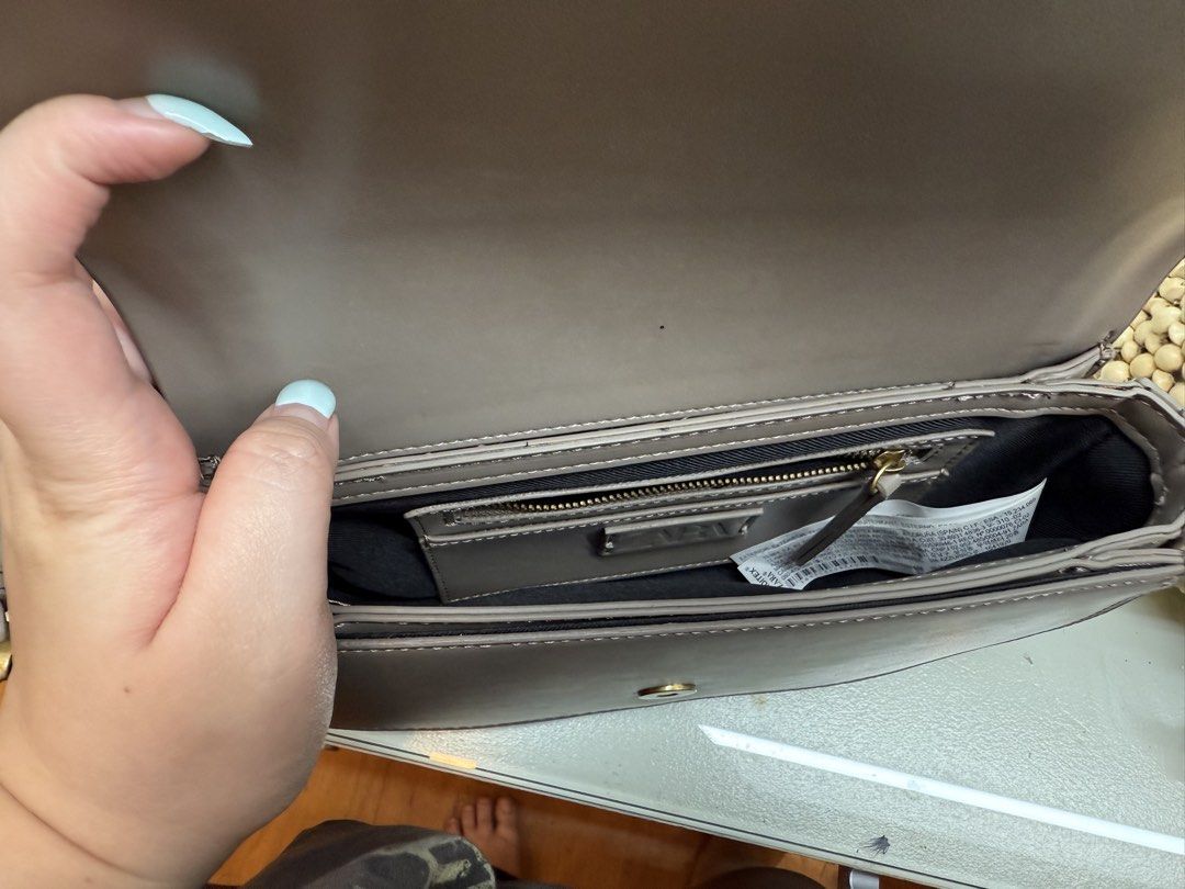 Zara Grey Shoulder Bag (Category: Shoulder Bags) located in Pasig City. Submitted by aria.dc.fonacier (Listing ID 1462366543, Image 3). Description: - Zara grey shoulder bag - Main compartment with inner zip pocket - Front zip pocket - Adjustable strap - Gold hardware details - Ideal for everyday use.