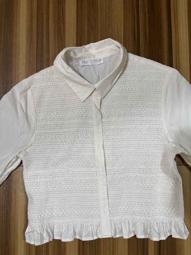 zara smocked top (Category: Blouses) located in Paranaque City. Submitted by frantootsky (Listing ID 1462349224, Image 1). Description: long sleeves button down, with smock detail.
