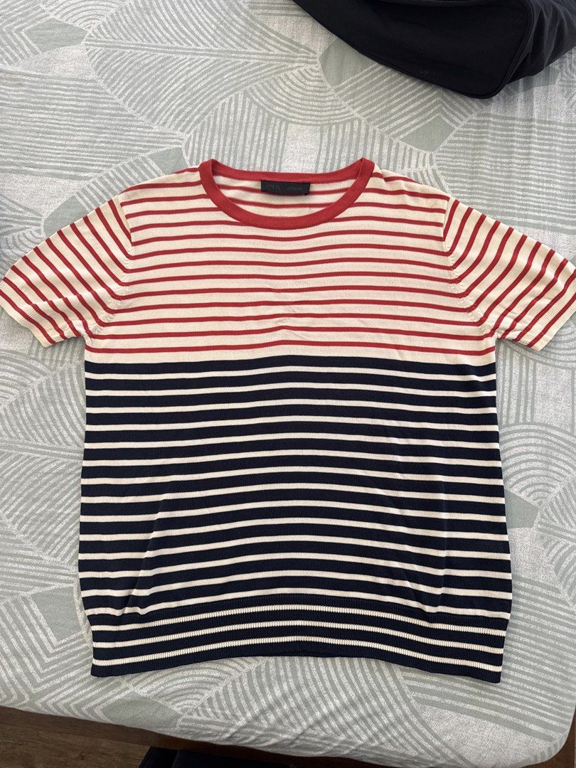 Zara Striped T-shirt (Category: Shirts) located in Manila. Submitted by pamelaurso90843 (Listing ID 1462265387, Image 1). Description: - Classic Zara striped t-shirt - Colors: Red, White, and Navy Blue - Features short sleeves and a crew neck - Ideal for everyday casual wear - Versatile: pairs well with jeans or shorts.