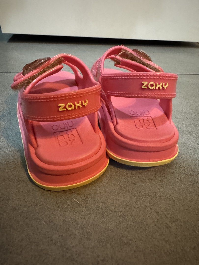 Zaxy Pink Glitter Heart Sandals (Category: Babies & Kids Fashion) located in Valenzuela. Submitted by eliviacollection (Listing ID 1462318320, Image 2). Description: 🩷Preloved Selling for 600 only (bought at 1,500) Used thrice only Cute pink sandals for little ones. Features sparkly heart details on the straps. Easy velcro closure for a snug fit. Very comfortable insoles. Great for everyday wear or special occasions..