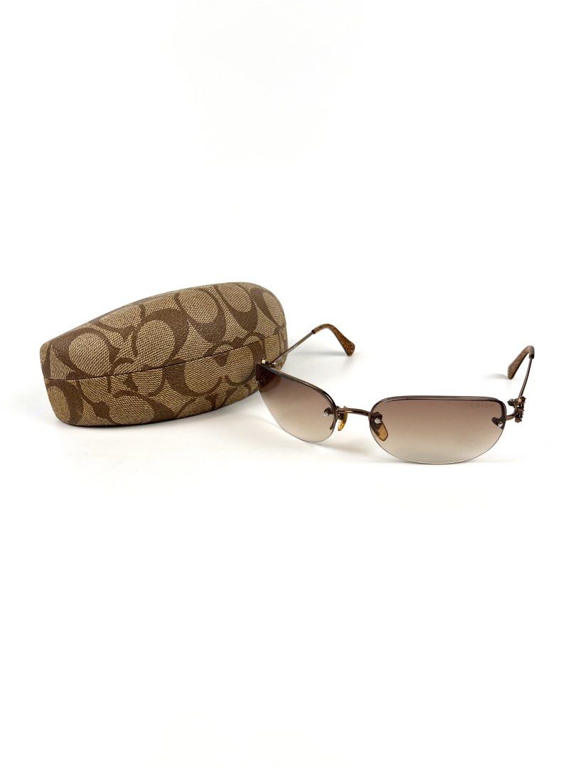 2000’s Coach Evonne Semi Rimless Sunglasses (Category: Sunglasses & Eyewear) located in Angeles City. Submitted by fruits.ph (Listing ID 1462498406, Image 1). Description: Brand: Coach Era: Y2K / Early 2000s Style: Semi Rimless Frame Color: Bronze Lens Color: Brown ***Comes with its authentic Coach protective case.*** MEASUREMENTS Lens height: 50 mm (5 cm) Temple: 120 mm Lens width: 45 mm Condition:8.5/10 Flaws: -Minor dents on frame arm, patina 
