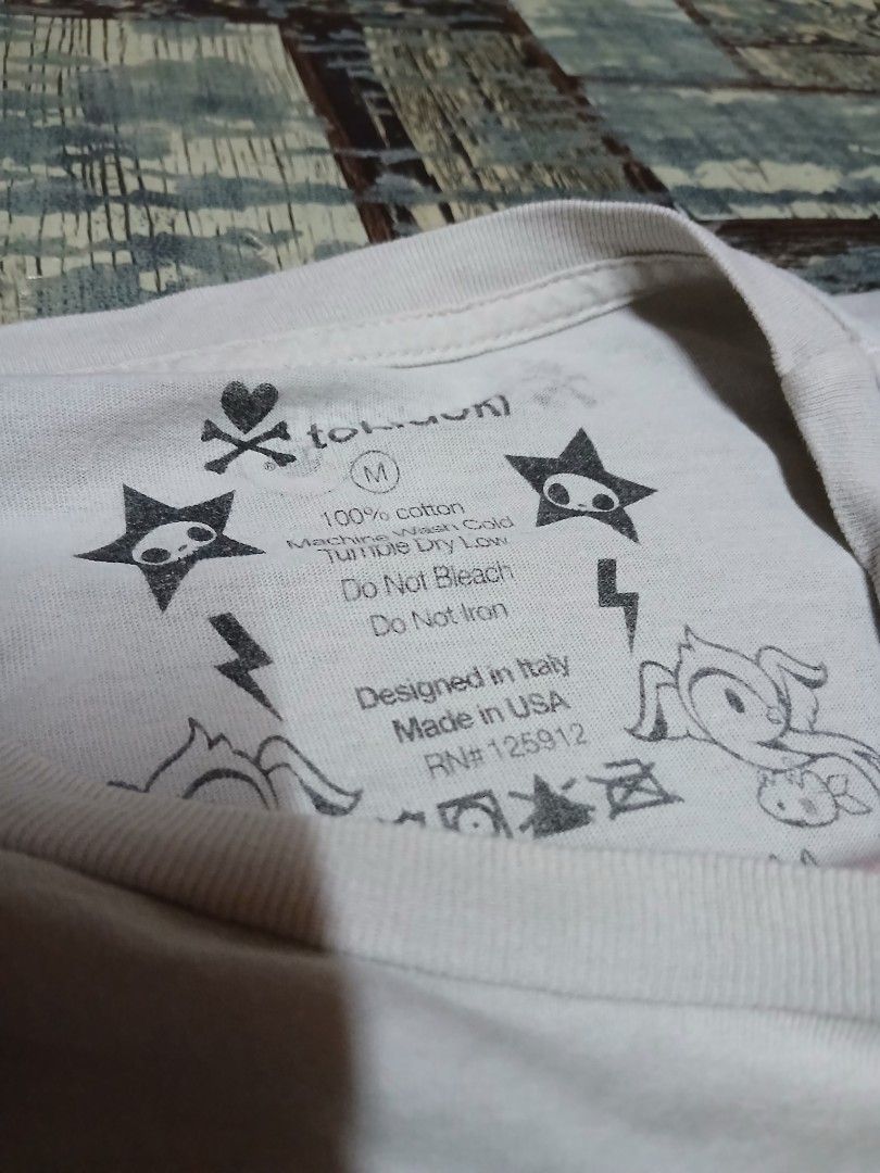 2000s Y2K Digicore Tokidoki Graphic Tee Shirt (Category: Tshirts & Polo Shirts ) located in Manila. Submitted by sendecluttersandsells (Listing ID 1462669700, Image 3). Description: Size: M Dimes: 20x29-30 Issue: None! Already Washed It Loc: Caloocan Ship: J&T Meetup: Monumento, SM Grand, Cloverleaf Mall (SM North, Trinoma Friday or Sunday).