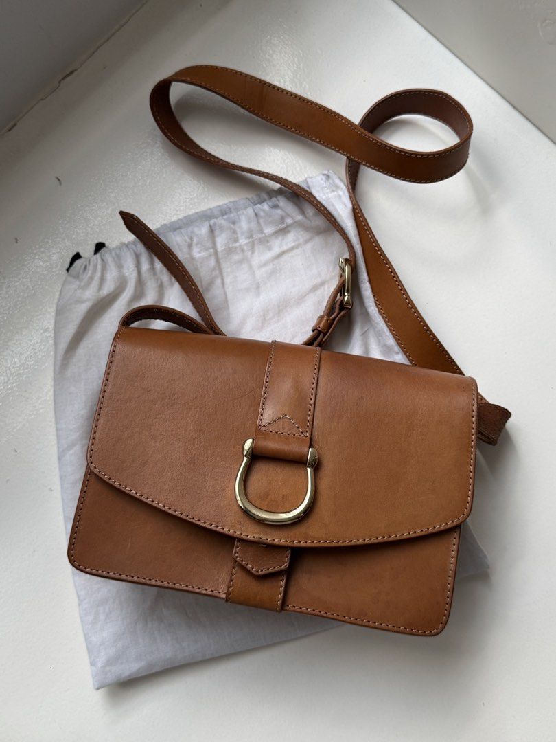 & Other Stories Bag (Category: Shoulder Bags) located in Pasay City. Submitted by shop.stylestaple (Listing ID 1462517569, Image 2). Description: - Brand: & Other Stories - Leather Shoulder Bag with Gold Hardware - Material: Brown Leather - Closure: Gold D-ring buckle - Interior: Black lining - Features: Adjustable strap - Includes: Dust bag - Ideal for: Everyday use.