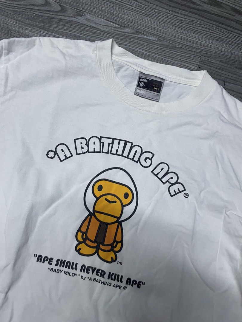 A Bathing Ape Baby Milo Long Sleeve Tee (Category: Tshirts & Polo Shirts ) located in Manila. Submitted by yourfavoriteplug (Listing ID 1462508520, Image 2). Description: - Brand: A Bathing Ape (BAPE) - Color: White - Style: Long Sleeve T-Shirt - Graphic: Iconic Baby Milo - Text Detail: 'Ape Shall Never Kill Ape' - Size: Large (L) - Condition: Great (for BAPE fans).