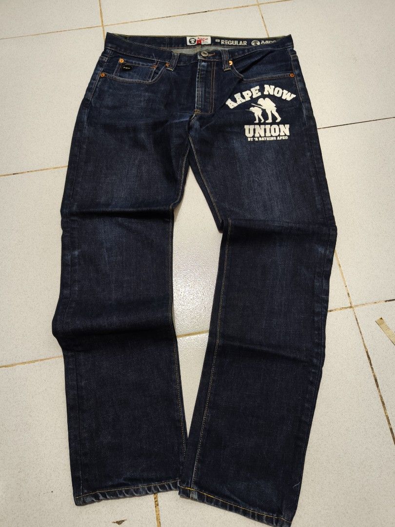 AAPE BY A BATHING APE Union Jeans (Category: Jeans) located in Manila. Submitted by truehorse-68cf (Listing ID 1462445515, Image 1). Description: - Brand: AAPE BY A BATHING APE - Style: Dark wash denim jeans - Feature: 'Aape Now Union' graphic print on right leg - Fit: Regular fit - Closure: Button and zip - Pockets: Classic five-pocket styling - Occasion: Great for casual wear w-34/31 L-41 authentic excellent condition accepting offers.