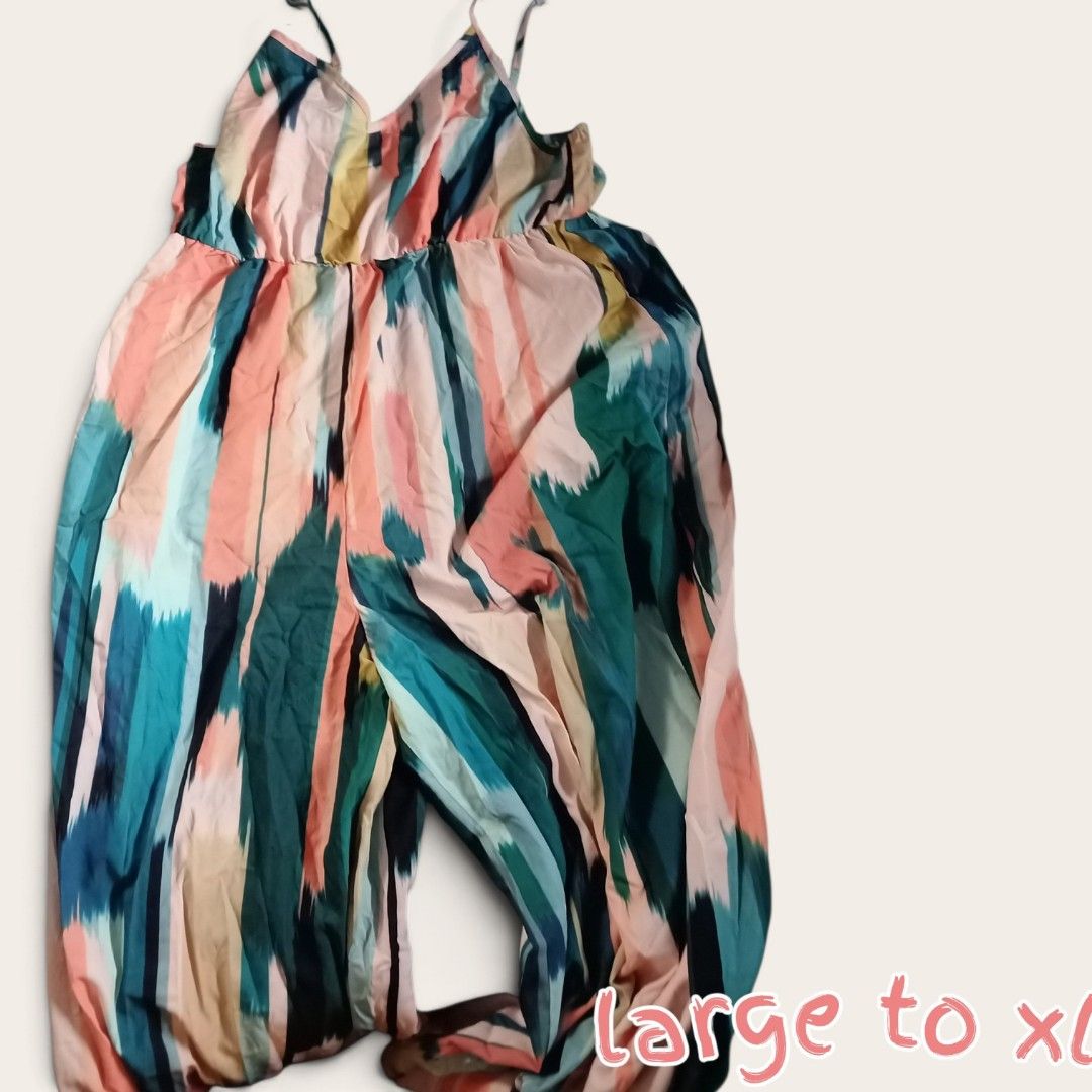 Abstract Print Jumpsuit - Size Large to XL (Category: Jumpsuits) located in Manila. Submitted by crustynico (Listing ID 1462456862, Image 1). Description: - Flowy jumpsuit with a vibrant abstract print - Features thin straps - Cinched waist for a flattering silhouette - Wide legs for ultimate comfort and a relaxed fit - Ideal for casual outings or beach vacations - Easy to wear and style.