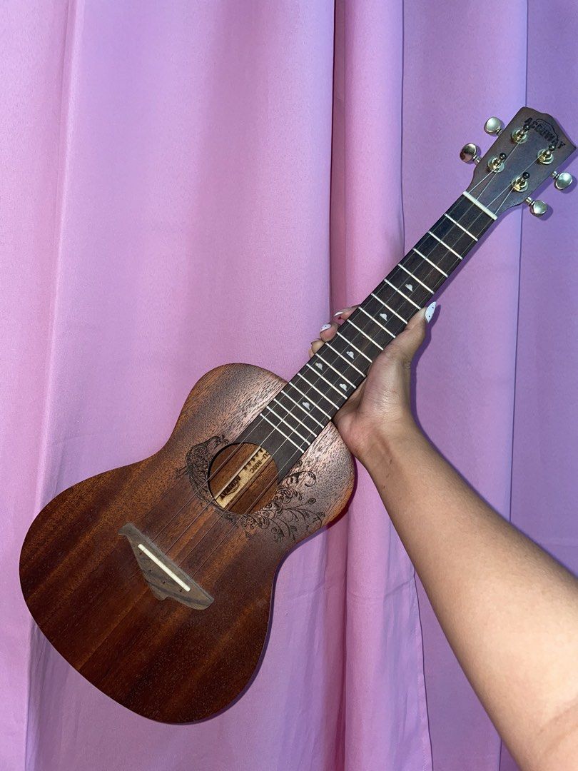 Acouway Ukulele with accessories (Category: Musical Instruments) located in Manila. Submitted by roxyqk (Listing ID 1462470626, Image 1). Description: - Acouway tuner, Colorful strap, Set of guitar picks, Capo, String, Small leather pouch, and bag - With stand! - Ideal for beginners - Used but not abused - Never got to learn how to play - Been years na hindi nagamit - NON NEGOTIABLE! this is the lowest price already .