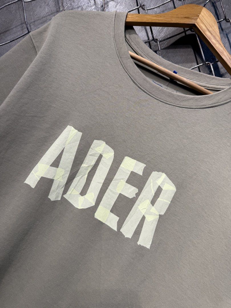 ADER Error T-shirt Grey Tape Logo (Category: Tshirts & Polo Shirts ) located in Manila. Submitted by ardobe.mnl (Listing ID 1462480253, Image 2). Description: Size: Medium Dimes: 20x28.5 Condition: Excellent Flaw: None.