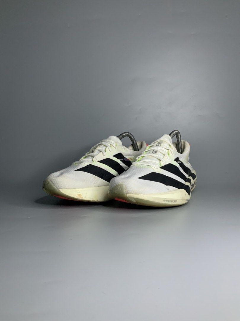 Adidas Adizero Adios 9 (Category: Sneakers) located in Cavite. Submitted by kalye_footwear (Listing ID 1462653163, Image 3). Description: - Adidas Adizero Adios 9 - Us 8 , Euro 41.5 , Cm 26 - Color: White with black stripes - Cushioning: Lightstrike Pro - Ideal for: Racing and fast training - Condition: Some writing on the sides (please check photos for details) .