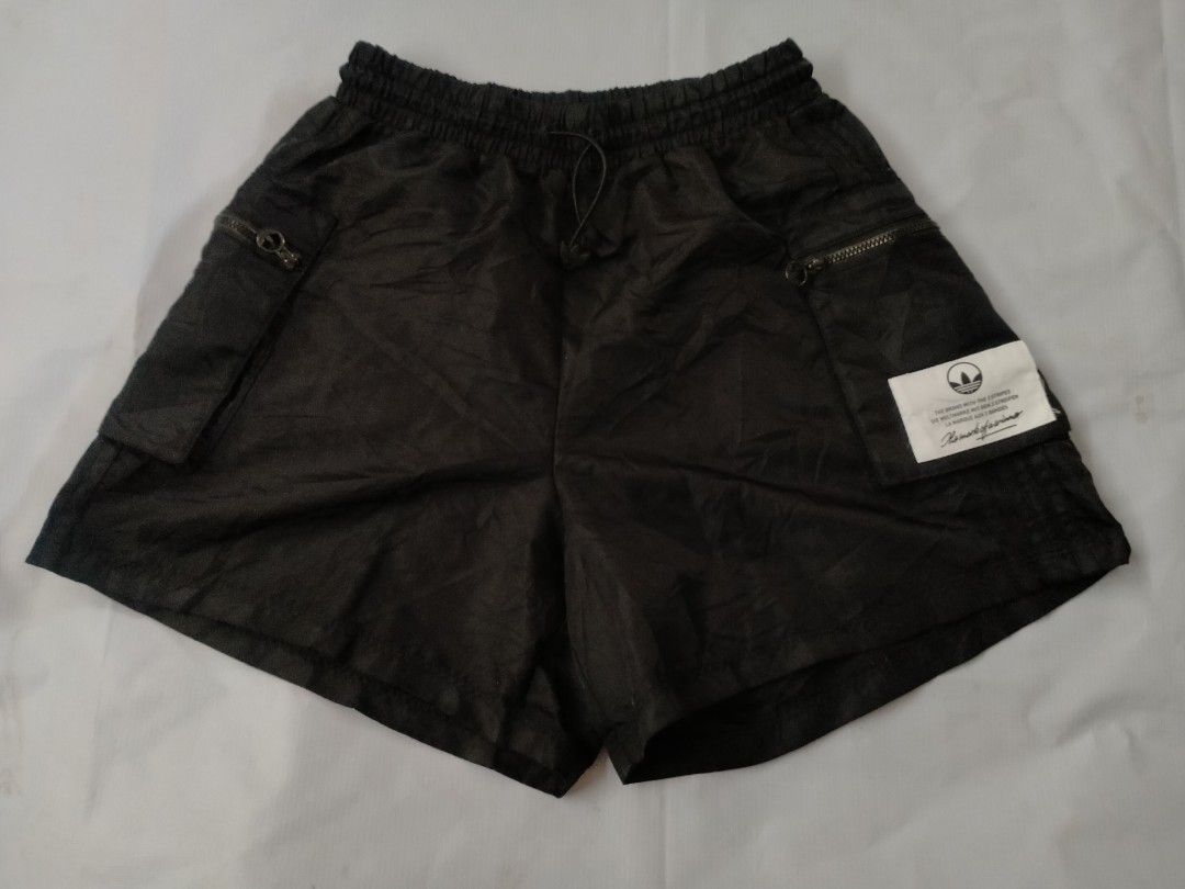 Adidas Black Cargo Shorts with Zippers (Category: Shorts) located in Davao. Submitted by ervinpolino09 (Listing ID 1462440459, Image 1). Description: - Black Adidas cargo shorts - Elastic waistband with drawstring - Two zippered front pockets - Two flap pockets - Adidas logo patch on right side - Made in Cambodia - Ideal for casual wear or sports Size 25-30 Length 14.5 Like New Condition Location Davao City .