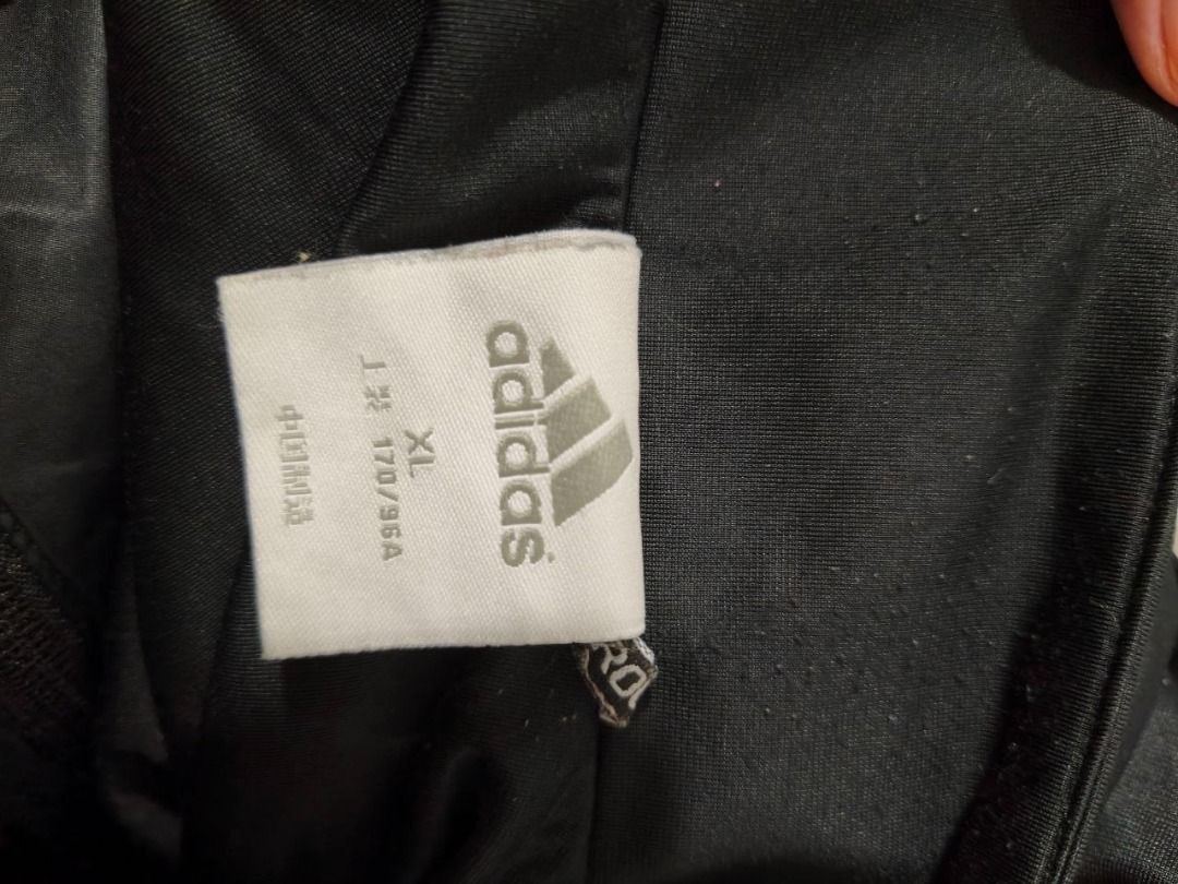 Adidas Black Hooded Jacket (Category: Coats, Jackets and Outerwear) located in Imus. Submitted by angworkinginamo (Listing ID 1462642366, Image 3). Description: - Black Adidas jacket - Size XL - Full zip front - Attached hood - Ribbed cuffs and hem - Adidas logo on chest - Ideal for casual wear or sports.