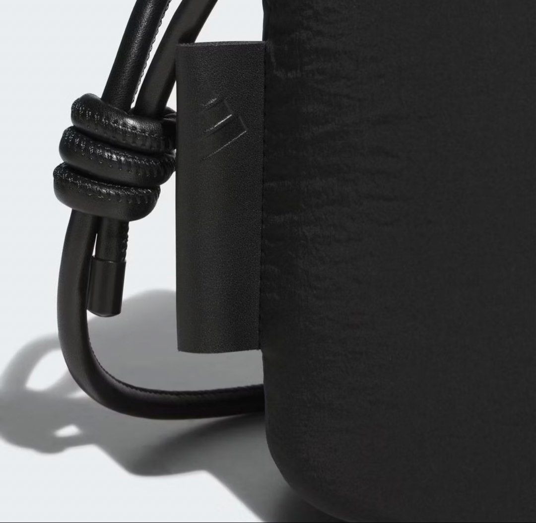 Adidas Black Nylon Drawstring Bucket Bag (Category: Cross-body Bags) located in Cagayan de Oro. Submitted by jeirn (Listing ID 1462604743, Image 2). Description: With tags at 2k - Black Adidas bucket bag - Made from durable nylon - Secure drawstring closure - Features a subtle embossed Adidas logo - Spacious enough for a water bottle and essentials - Ideal for everyday use or gym sessions.