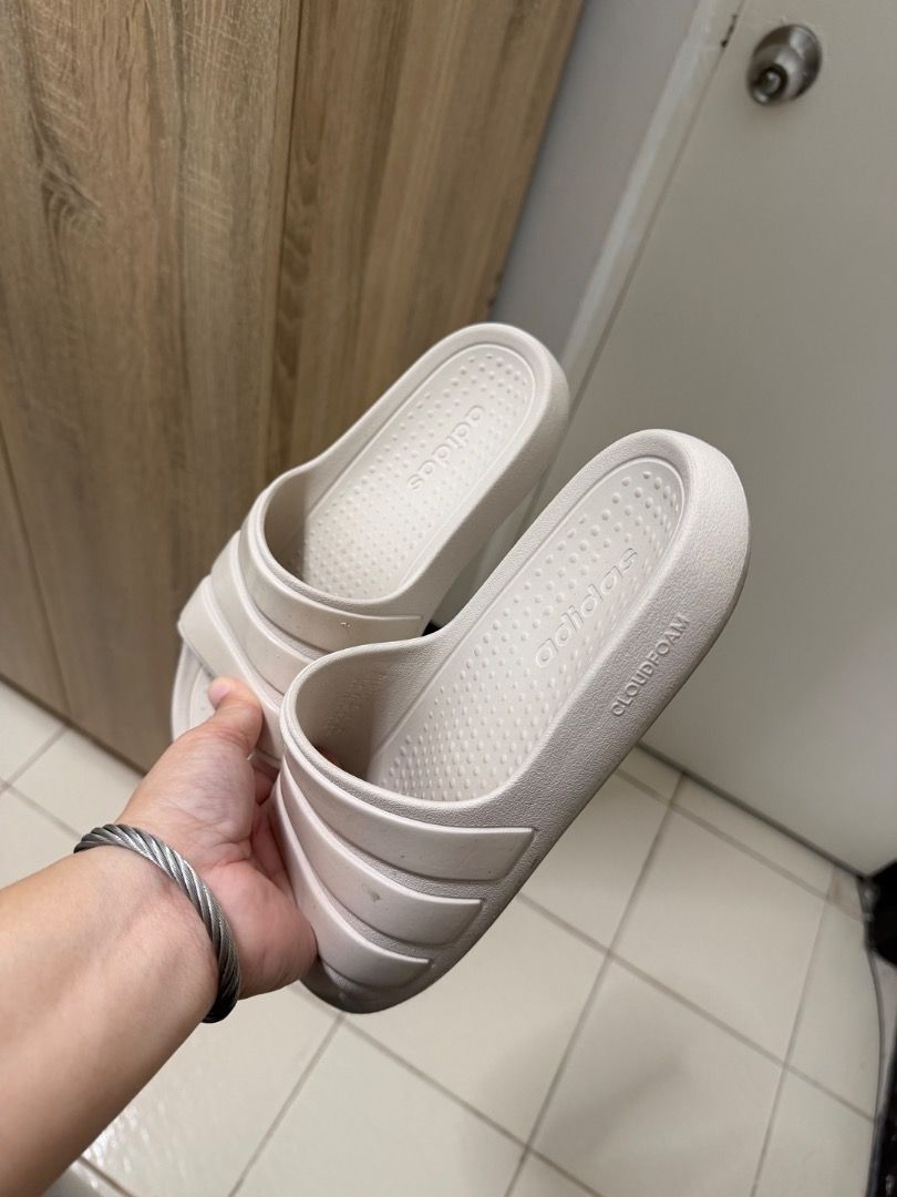 Adidas Cloudfoam Slides Beige (Category: Slippers and slides) located in Caloocan City. Submitted by kosmofrance (Listing ID 1462458877, Image 1). Description: - Adidas slides in a light beige color. - Features the iconic three stripes on the strap. - Equipped with Cloudfoam cushioning for ultimate comfort. - Easy slip-on design for convenience. - Ideal for everyday casual wear or recovering after sports..