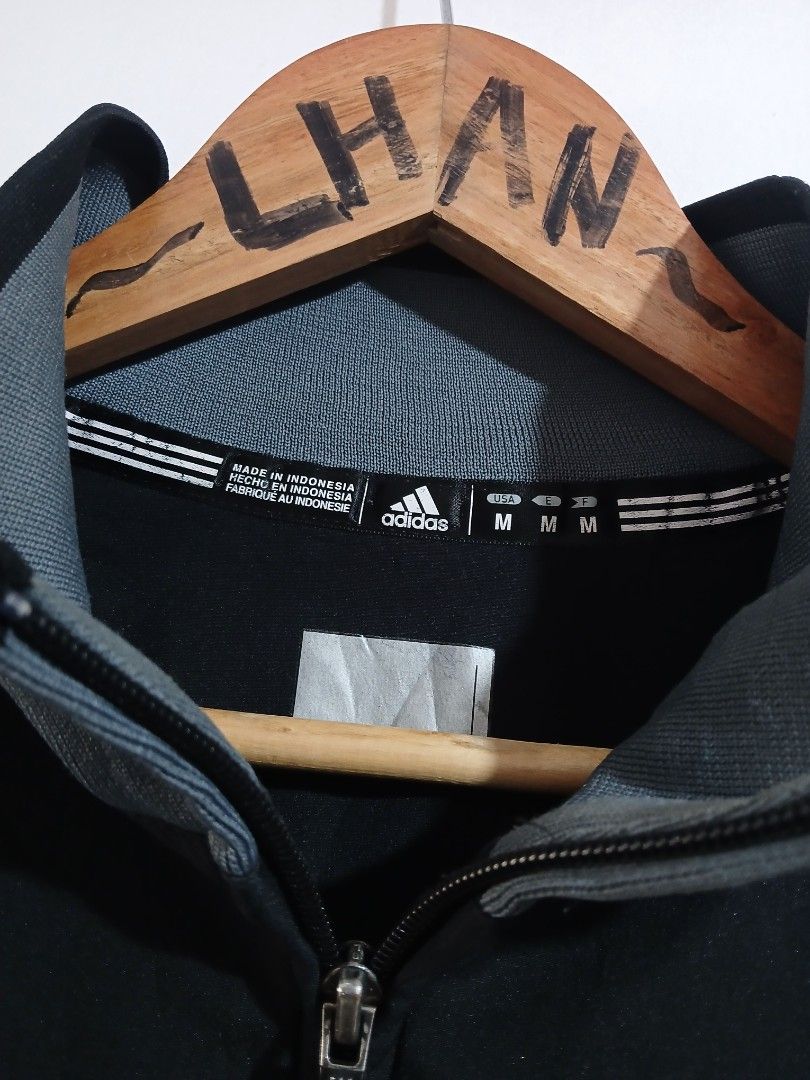Adidas De La Salle Baseball Track Jacket Size M (Category: Coats, Jackets and Outerwear) located in Taguig. Submitted by thriftnilhan (Listing ID 1462490776, Image 3). Description: - Black Adidas track jacket - Size: Medium (W 23 L 29) - 'De La Salle Baseball' embroidered on back - Number '11' on front - Grey accents on collar, cuffs, and hem - Made in Indonesia.
