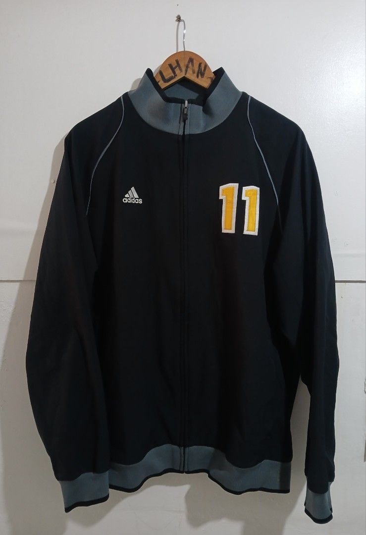 Adidas De La Salle Baseball Track Jacket Size M (Category: Coats, Jackets and Outerwear) located in Taguig. Submitted by thriftnilhan (Listing ID 1462490776, Image 1). Description: - Black Adidas track jacket - Size: Medium (W 23 L 29) - 'De La Salle Baseball' embroidered on back - Number '11' on front - Grey accents on collar, cuffs, and hem - Made in Indonesia.