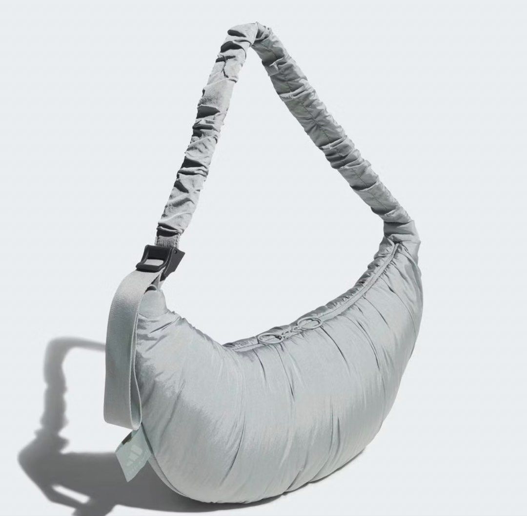 Adidas Padded Crescent Shoulder Bag - Light Grey (Category: Shoulder Bags) located in Cagayan de Oro. Submitted by jeirn (Listing ID 1462605472, Image 1). Description: With tags at 1,800 - Super cute and puffy Adidas crescent bag - Trendy light grey color - Adjustable strap with gathered detail - Plenty of space inside for essentials - Great for everyday use or a night out.
