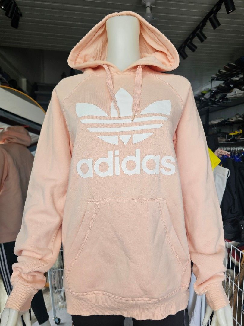 Adidas Peach Hoodie Sweatshirt (Category: Coats, Jackets and Outerwear) located in Baguio. Submitted by kayeonlineshop (Listing ID 1462514929, Image 2). Description: -peach-colored Adidas Originals hoodie featuring the iconic white Trefoil logo and wordmark across the chest. -measurements included in the photos.