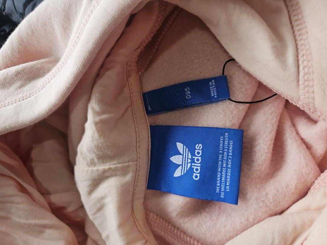 Adidas Peach Hoodie Sweatshirt (Category: Coats, Jackets and Outerwear) located in Baguio. Submitted by kayeonlineshop (Listing ID 1462514929, Image 3). Description: -peach-colored Adidas Originals hoodie featuring the iconic white Trefoil logo and wordmark across the chest. -measurements included in the photos.