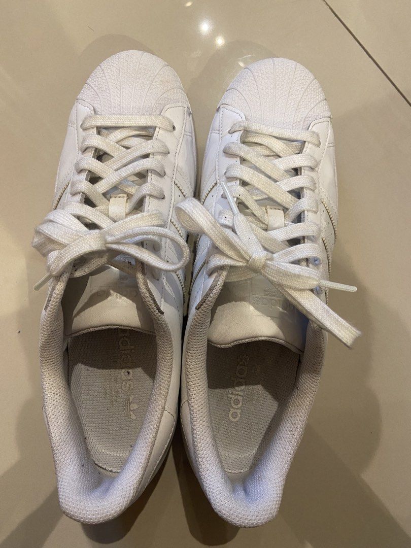 Adidas Superstar White Shell Toe Sneakers (Category: Sneakers) located in Makati City. Submitted by iamfriday (Listing ID 1462509210, Image 1). Description: - very good condition Well taken care of Ready to use Classic white Adidas Superstar sneakers - Iconic shell toe design - Signature three stripe detailing - White laces - Made in Vietnam - Size: 9.5 US.