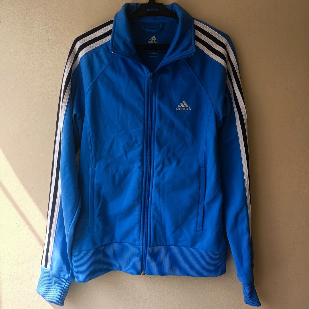 Adidas Track Jacket Blue White Black Stripes (Category: Coats, Jackets and Outerwear) located in Pasig City. Submitted by prelovedbym33 (Listing ID 1462459325, Image 1). Description: - Classic blue Adidas track jacket - Signature three stripes on sleeves - Full zip closure - Ribbed cuffs and hem for a snug fit - Two convenient side pockets - Ideal for everyday wear or athletic activities.
