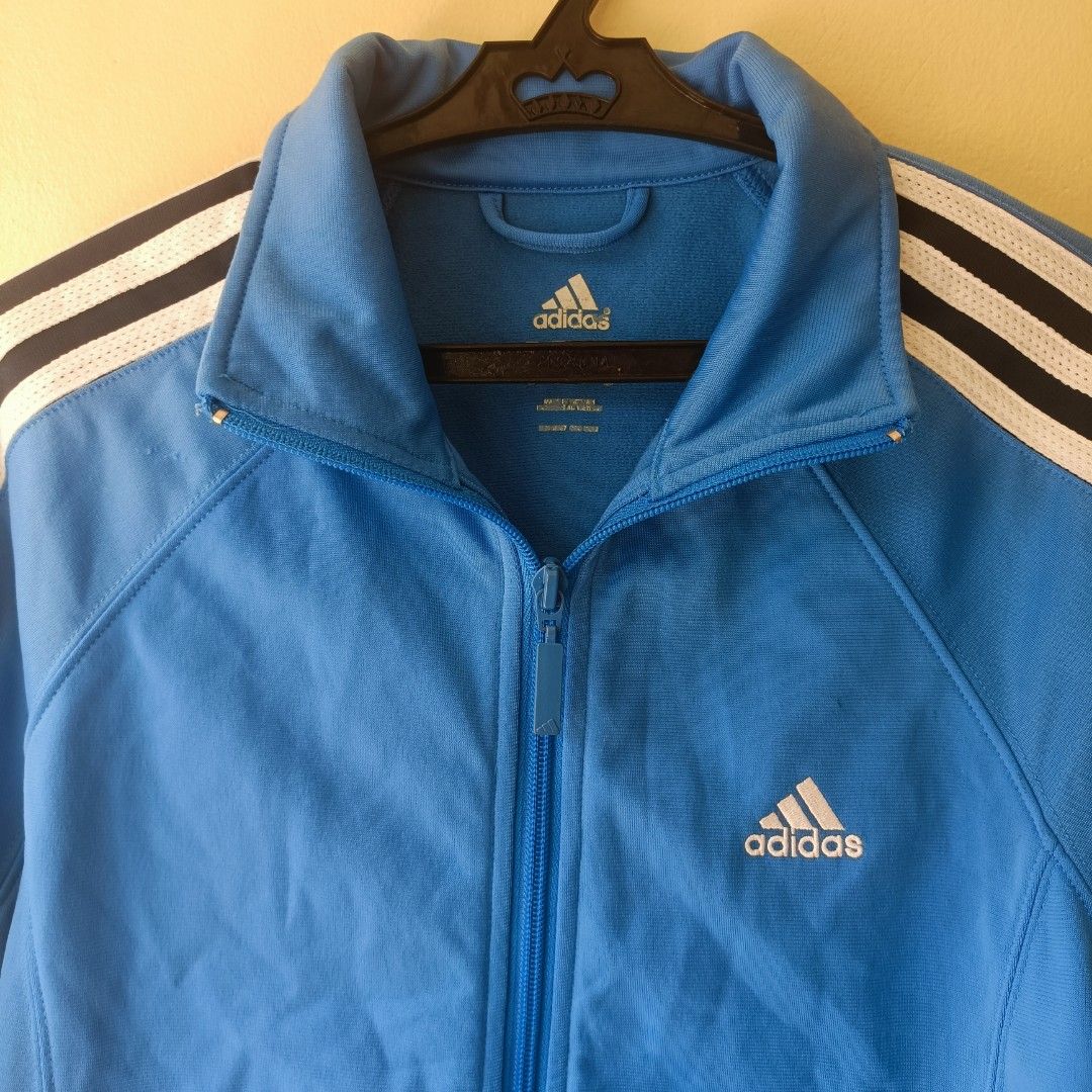 Adidas Track Jacket Blue White Black Stripes (Category: Coats, Jackets and Outerwear) located in Pasig City. Submitted by prelovedbym33 (Listing ID 1462459325, Image 2). Description: - Classic blue Adidas track jacket - Signature three stripes on sleeves - Full zip closure - Ribbed cuffs and hem for a snug fit - Two convenient side pockets - Ideal for everyday wear or athletic activities.