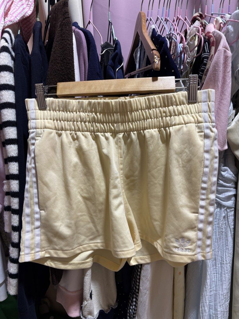 Adidas Yellow Shorts with 3 Stripes (Category: Shorts) located in Balagtas. Submitted by sabrinacarpenteroww (Listing ID 1462520022, Image 1). Description: fits 27-30.