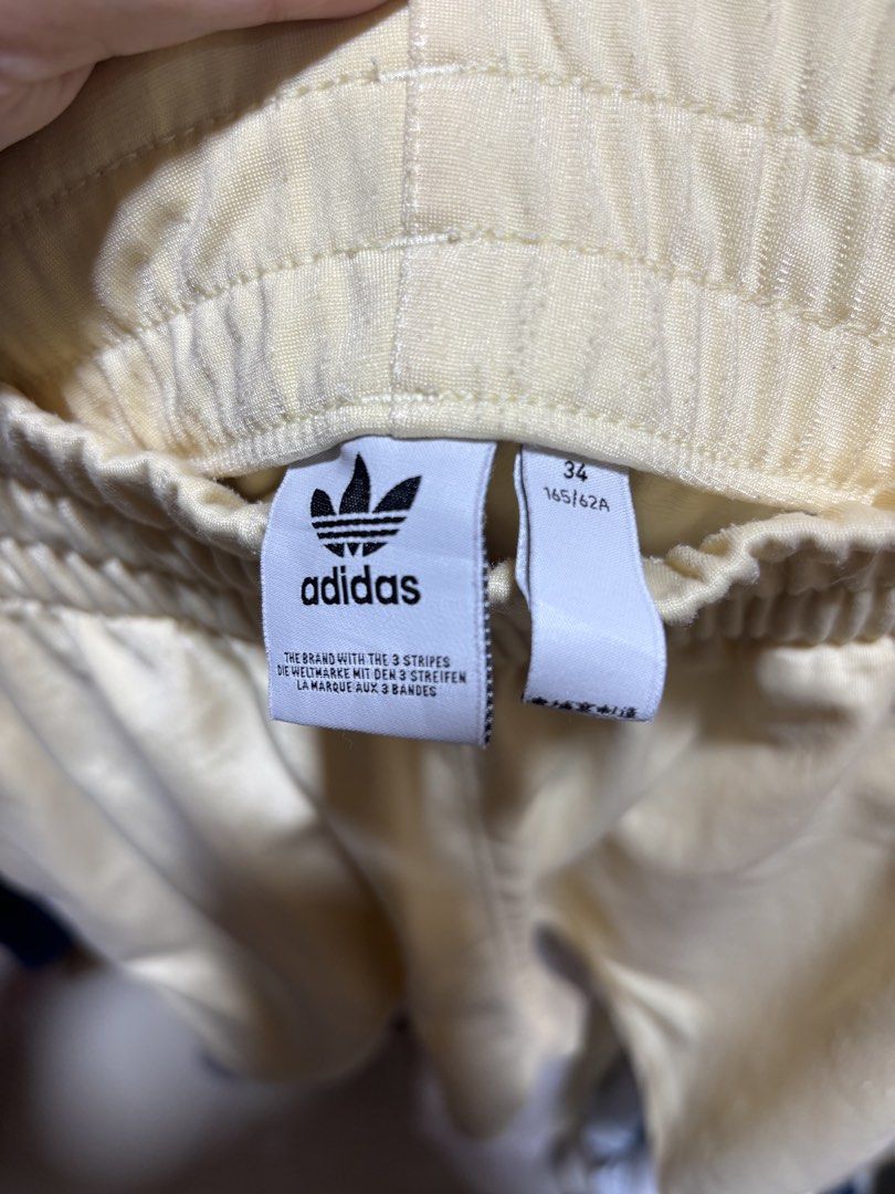 Adidas Yellow Shorts with 3 Stripes (Category: Shorts) located in Balagtas. Submitted by sabrinacarpenteroww (Listing ID 1462520022, Image 3). Description: fits 27-30.