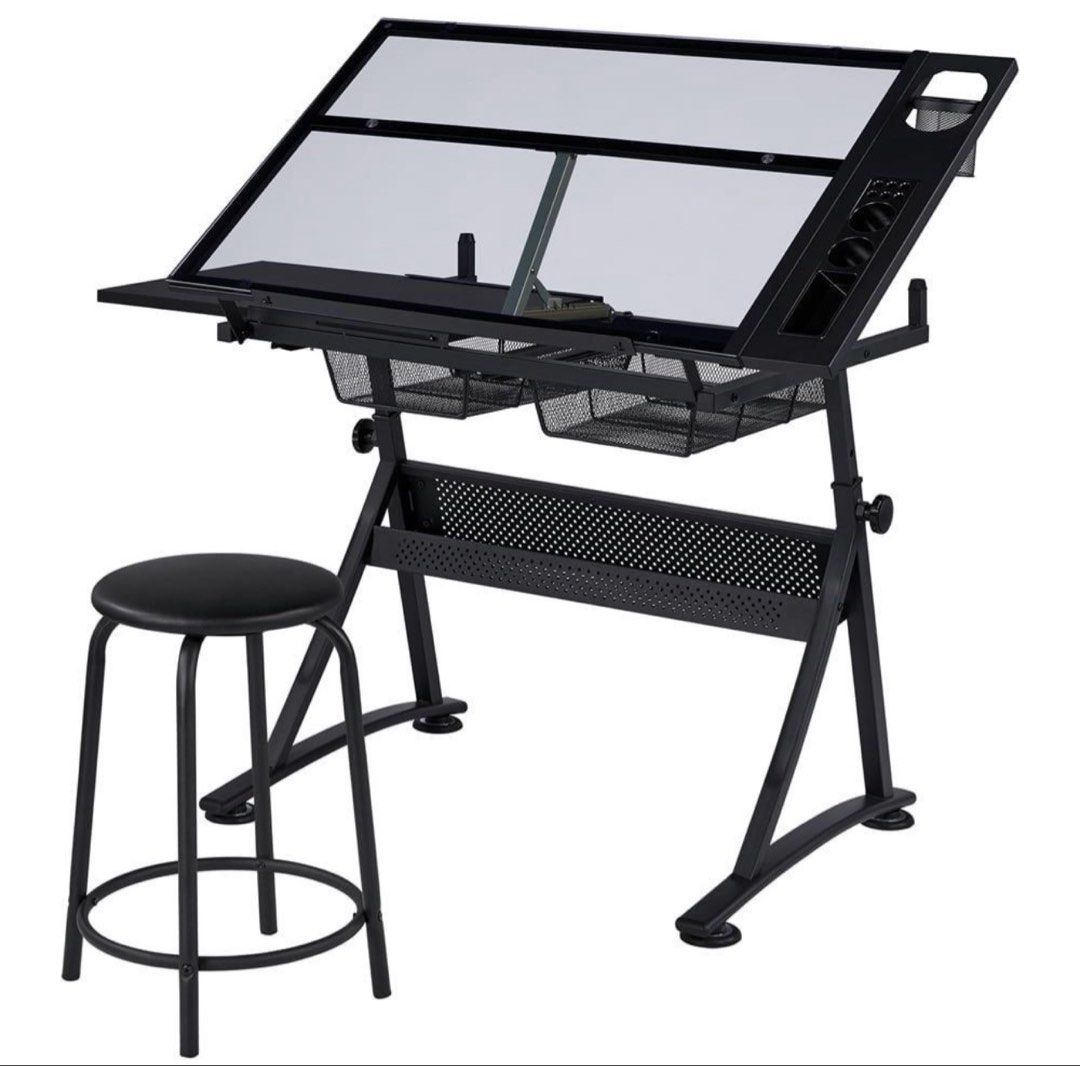 Adjustable Drafting Table with Stool (Category: Tables & Sets) located in Manila. Submitted by ongdhrexdi28098 (Listing ID 1462467025, Image 1). Description: - Adjustable black metal drafting table with sleek glass top - Includes a comfortable stool - Two convenient mesh storage baskets underneath - Handy side organizer for pens and tools - Glass top angle is adjustable for your comfort - Ideal for drawing, art, and crafting projects Used for man