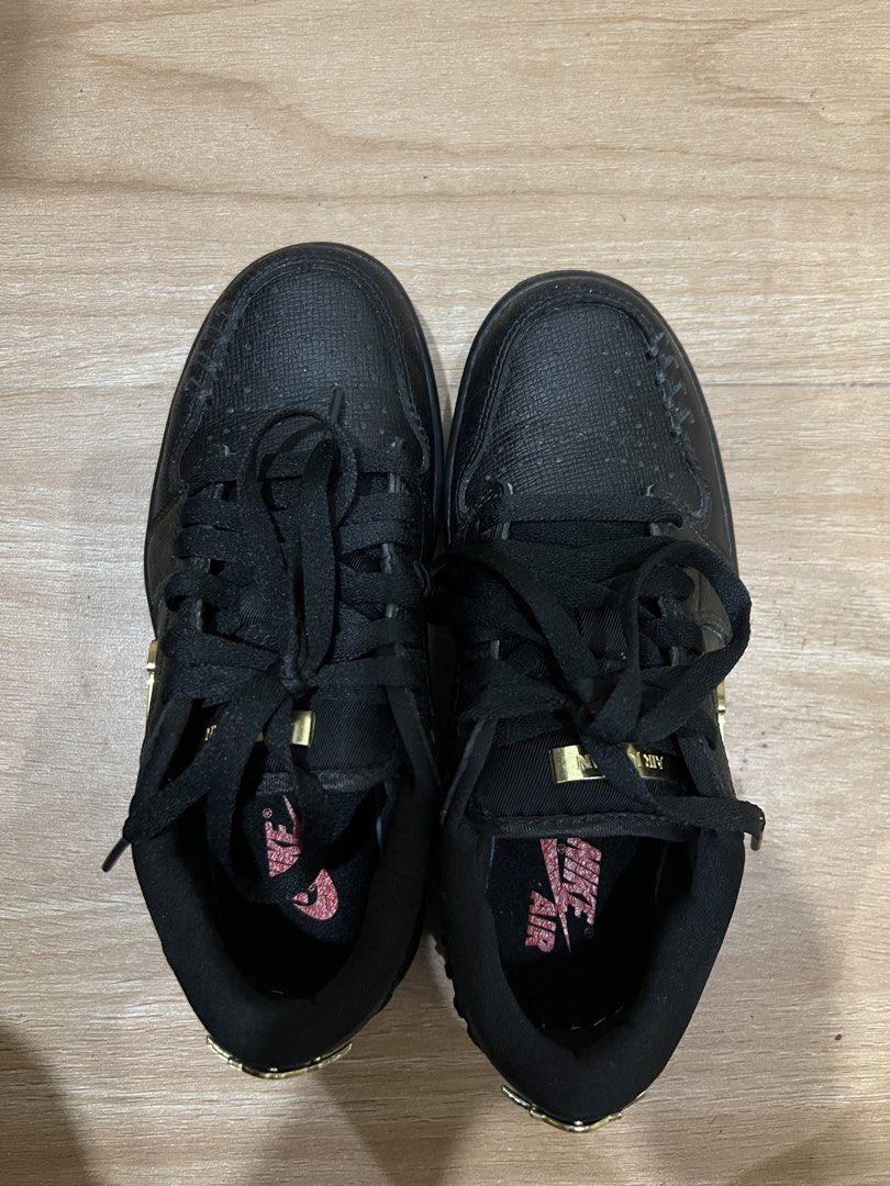 Air Jordan 1 Low Black Gold (Category: Sneakers) located in Muntinlupa City. Submitted by lememoir (Listing ID 1462614651, Image 2). Description: - Size 6 and 7 Womens (can fit) - Classic Black Air Jordan 1 Low silhouette - Eye-catching gold accents on Nike swoosh and heel logo - Unique textured upper for added style - Comes with sleek black laces - Features a fun pink glitter Air Jordan logo on the insoles - Perfect addition to any sneakerhead's