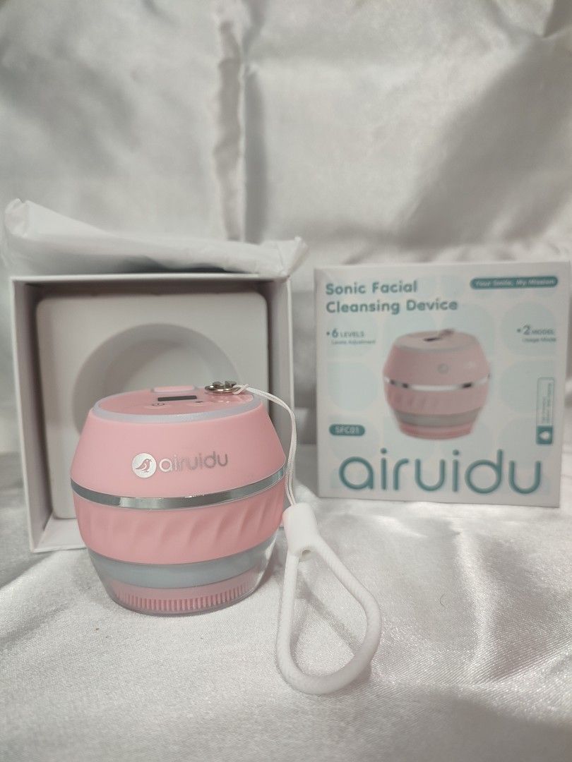 Airuidu Sonic Facial Cleansing Device Pink (Category: Face Care) located in Manila. Submitted by shoppingwithgee (Listing ID 1462568615, Image 1). Description: - Brand new pink Sonic facial cleansing device - 6 adjustable intensity levels - 2 cleaning modes - Comes with a convenient strap - Ideal for effective facial cleansing - Still sealed in its original box.