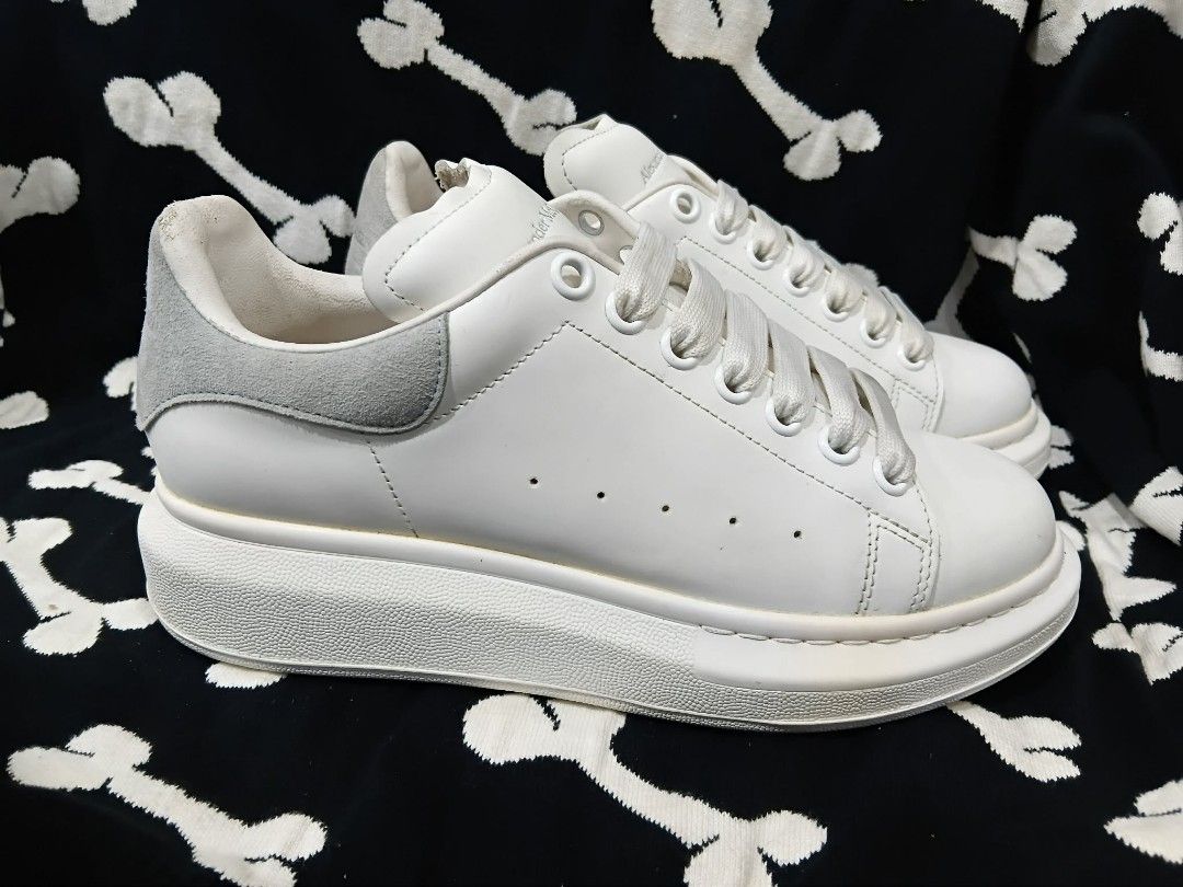 Alexander McQueen Oversized Sneakers White (Category: Sneakers & Footwear) located in Subic. Submitted by adamdwyane (Listing ID 1462477838, Image 3). Description: - Authentic Alexander McQueen oversized sneakers - White leather with grey suede heel and tongue accents - Signature chunky sole - White laces - Classic, versatile style for everyday wear - Selling because they are no longer needed.