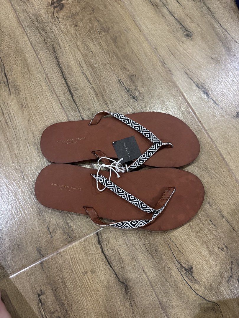 American Eagle & Tommy Hilfiger Flip Flops - Size 8 (Category: Slippers and slides) located in Quezon City. Submitted by eyabanana08 (Listing ID 1462599004, Image 2). Description: - Set of 2 pairs of flip flops - free sf if getting both 500 each, 1k both - Size: 8 - American Eagle: Brown with patterned strap - Tommy Hilfiger: Navy with red, white, and blue patterned strap - Ideal for casual outings and everyday wear.