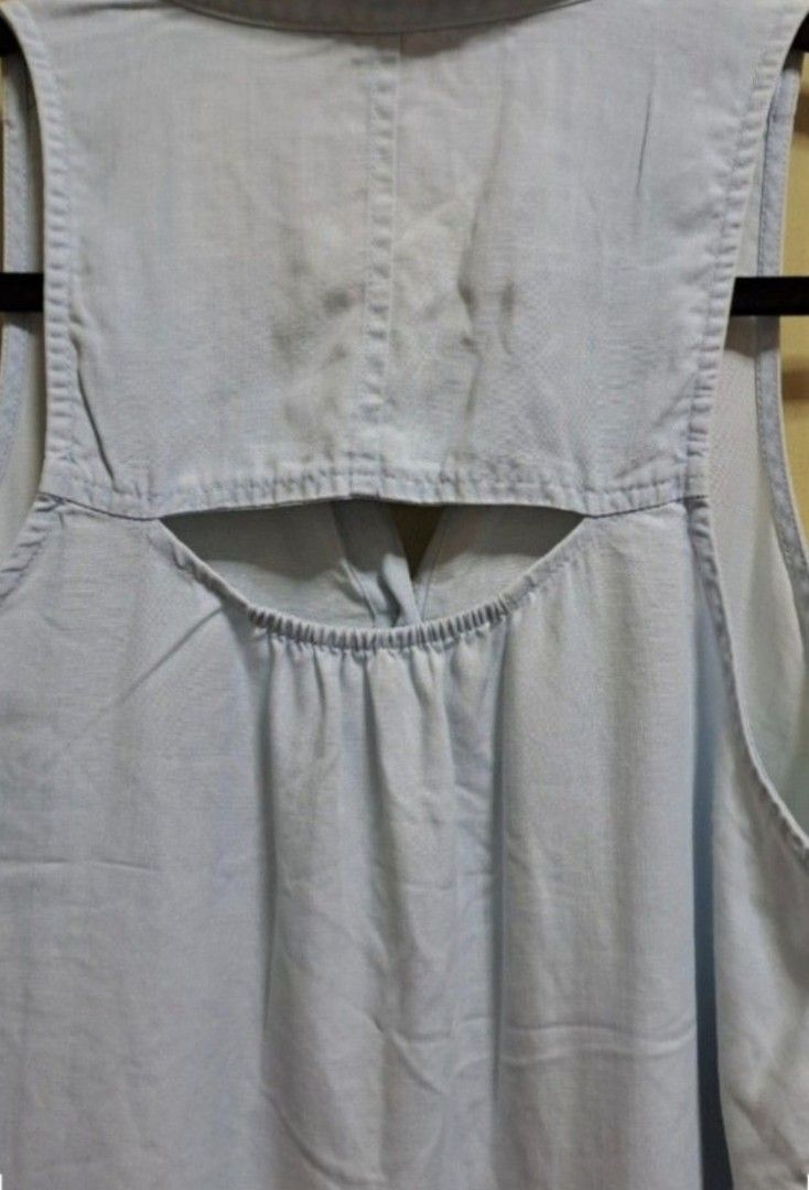 American Eagle Sleeveless Polo Blouse (Category: Sleeveless) located in Manila. Submitted by thrifter_lifestyle (Listing ID 1462600250, Image 3). Description: Brand: American Eagle (bought in US) Collared Sleeveless Button down with single pocket in front Back has cutout hole design (see photo) Bust: 40" Material: Cotton Actual Color: Very light washout blue No issues 😀 RFS: no longer fits me, no worn photos..