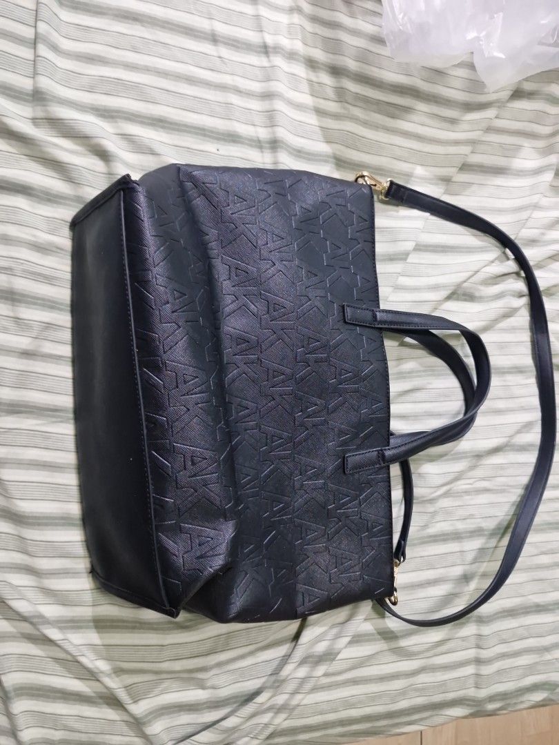 Anne Klein Black Tote Bag with Embossed Logo (Category: Tote Bags) located in Manila. Submitted by inaydearest (Listing ID 1462444122, Image 2). Description: - Brand: Anne Klein - Color: Black - Design: All-over embossed logo pattern - Interior: Main compartment with a zip pocket - Straps: Detachable shoulder strap included - Hardware: Gold-tone - Ideal for: Everyday use - Negotiable Price .