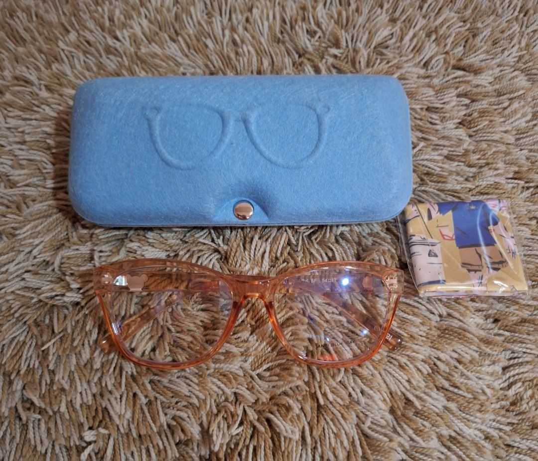 Antepara BT21 Eyeglasses (Category: Sunglasses & Eyewear) located in Rizal. Submitted by mirisica (Listing ID 1462568573, Image 2). Description: - Trendy orange cat-eye frames - Anti-blue light lenses for eye protection - Comes with a protective blue hard case - Includes a microfiber cleaning cloth - Adorable character designs on the arms - Ideal for daily computer use and gaming - Protect your eyes while looking stylish.